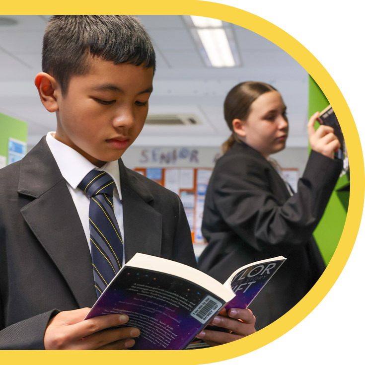 Students browsing books in the library at St Agnes Catholic High School Rooty Hill