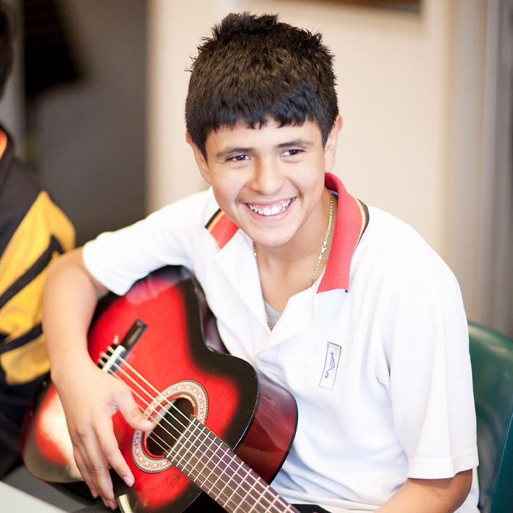 Student playing the guitar at St Agnes Catholic High School Rooty Hill