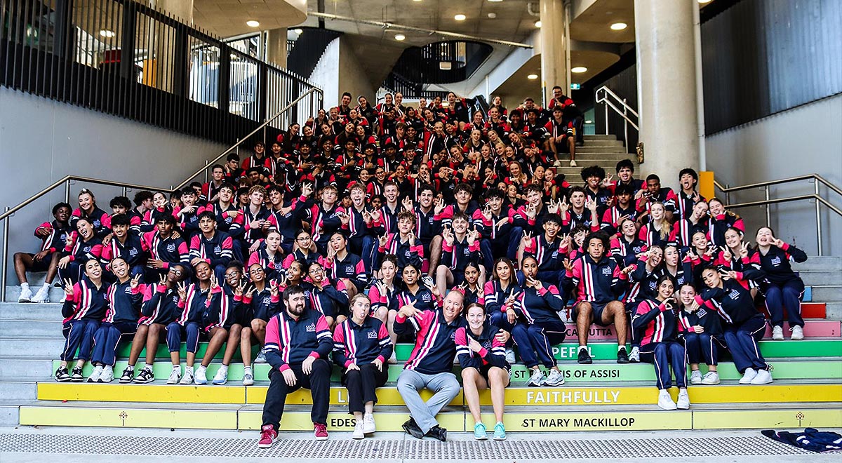 Santa Sophia Catholic College Gables students sitting on steps