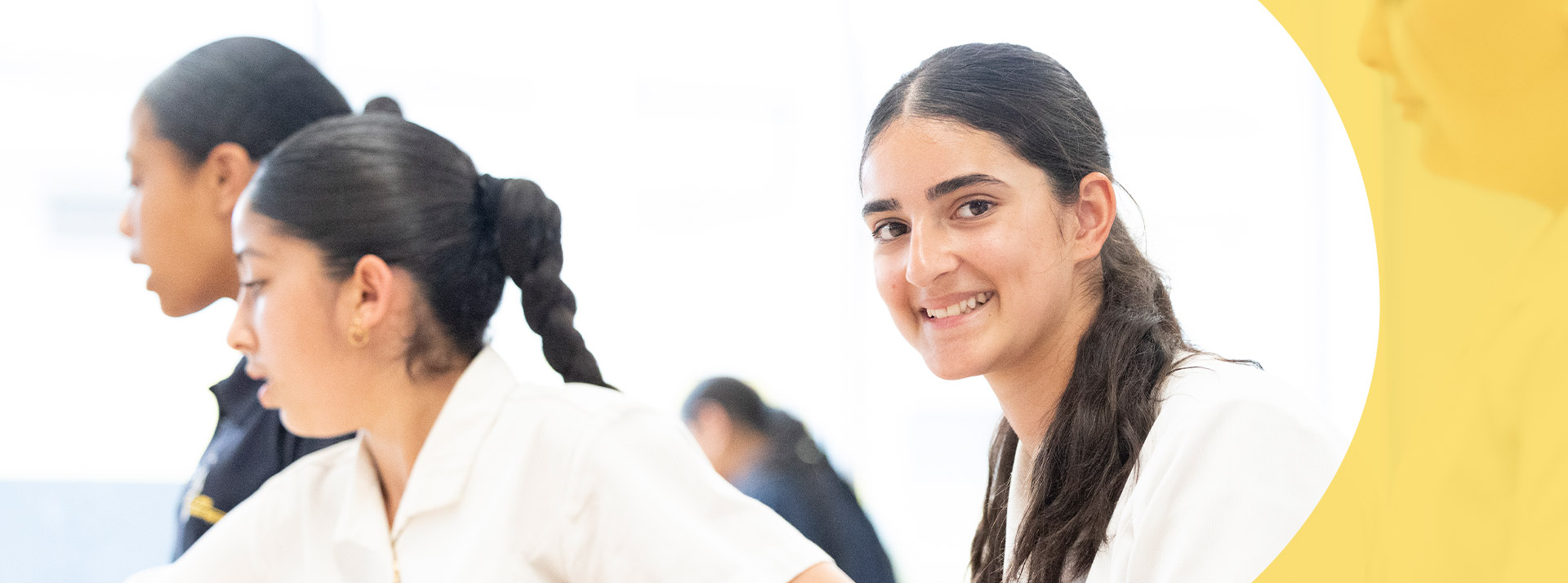 Student smiling in the classroom at St Agnes Catholic High School Rooty Hill