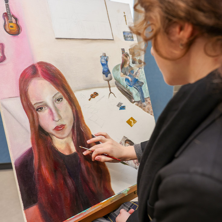 Student working on her artwork in the classroom at St Agnes Catholic High School Rooty Hill