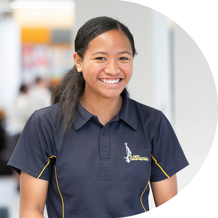 Student smiling at the camera at St Agnes Catholic High School Rooty Hill